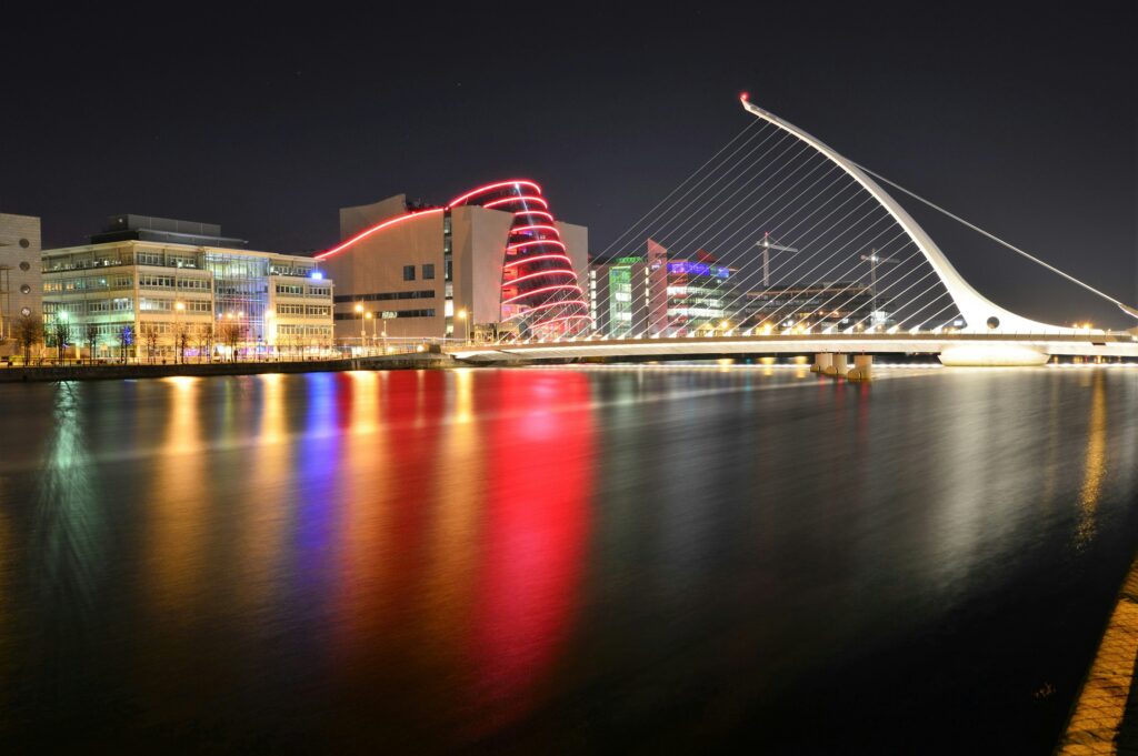 The Convention Centre Dublin and Samuel Beckett Bridge reflected in the River Liffey at twilight