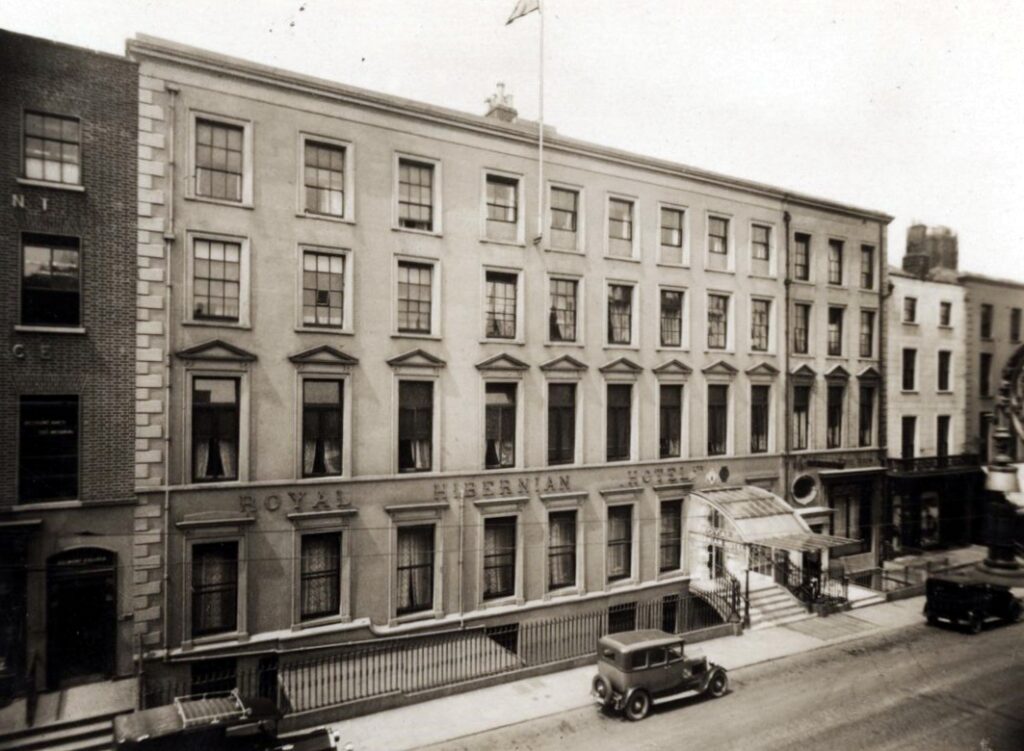 An old building with the sign 'The Royal Hibernian Hotel' across the front.